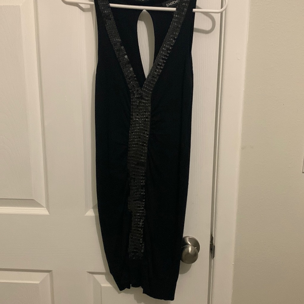 Bebe form fitting, little black dress with sequin trim, size small, gently worn